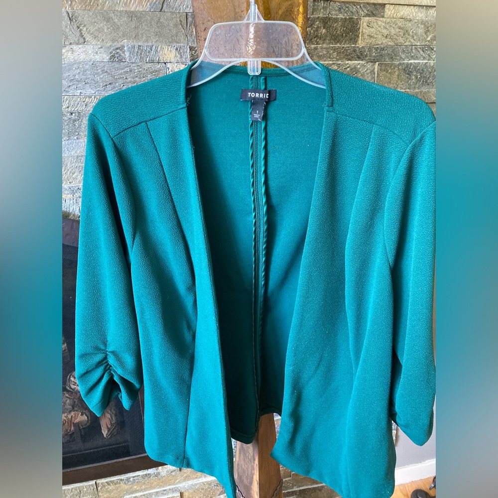 Emerald green blazer.